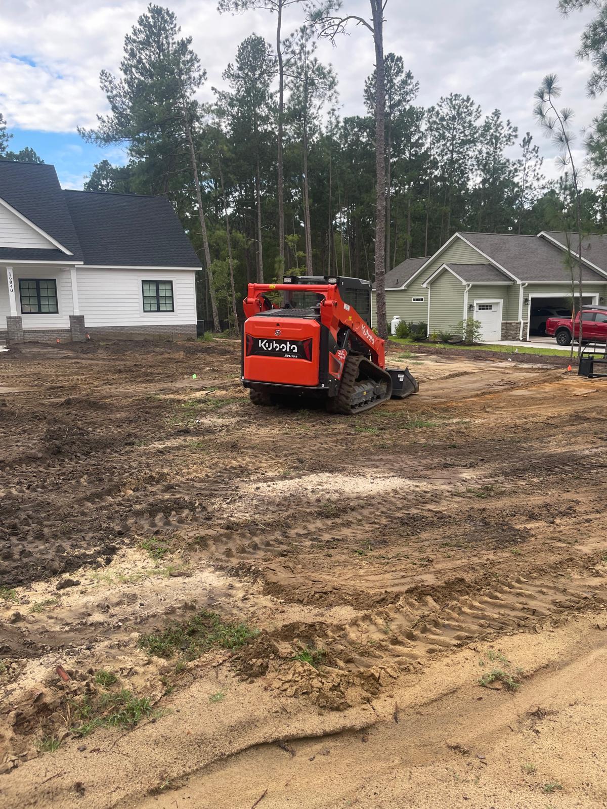 Kubota equipment working on a residential property