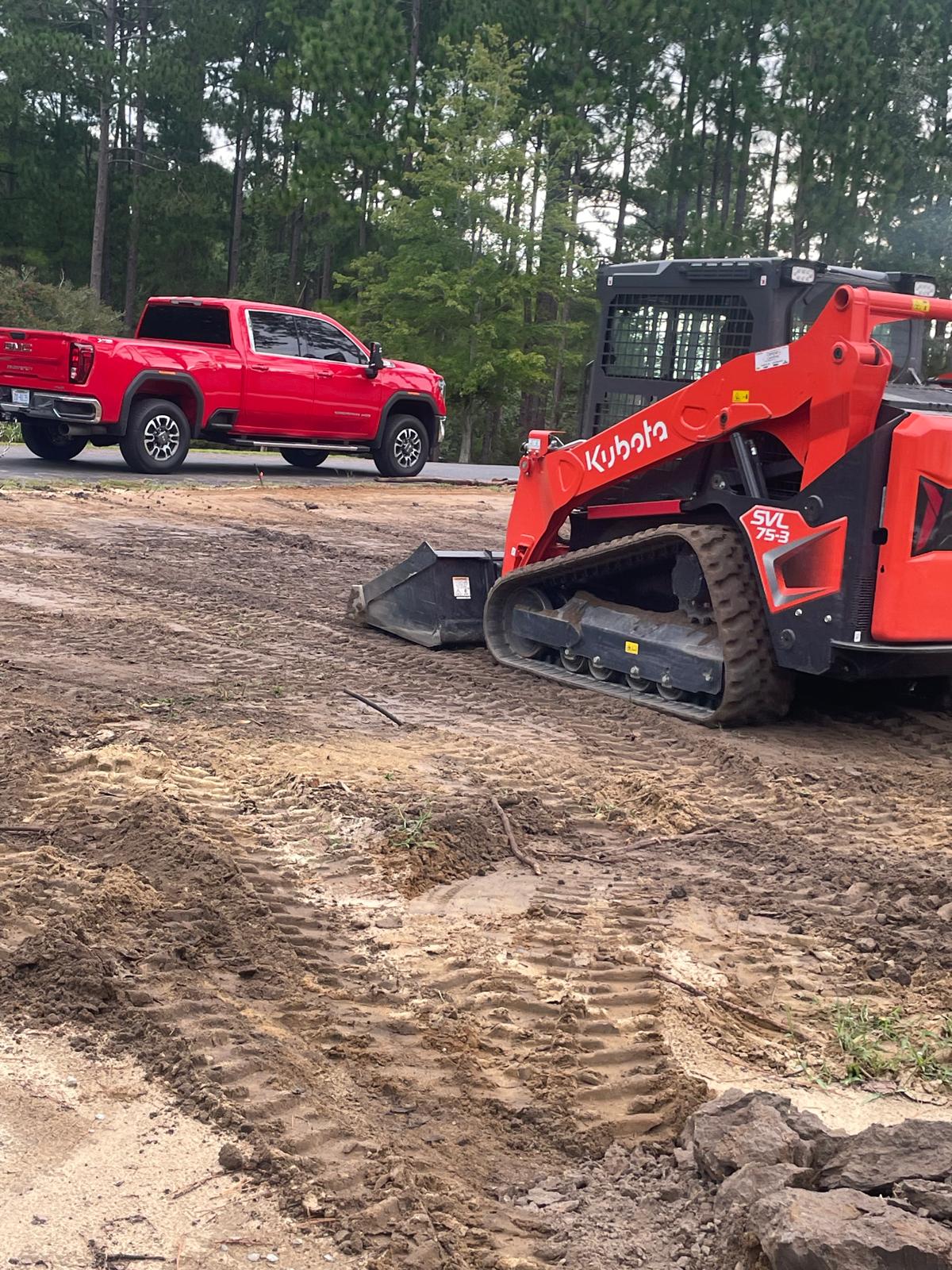 Kubota track loader working on a property