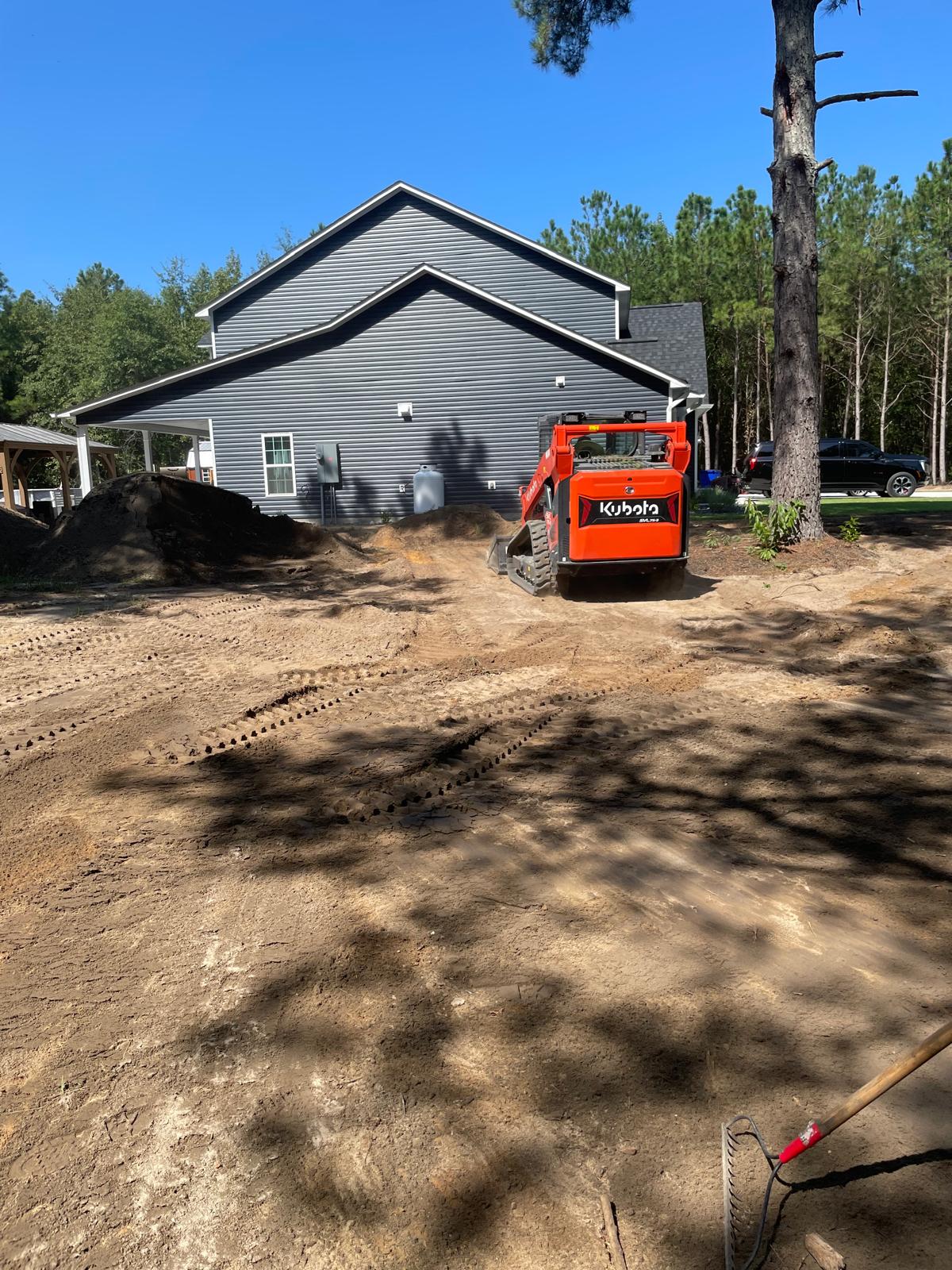 Kubota equipment preparing a residential yard